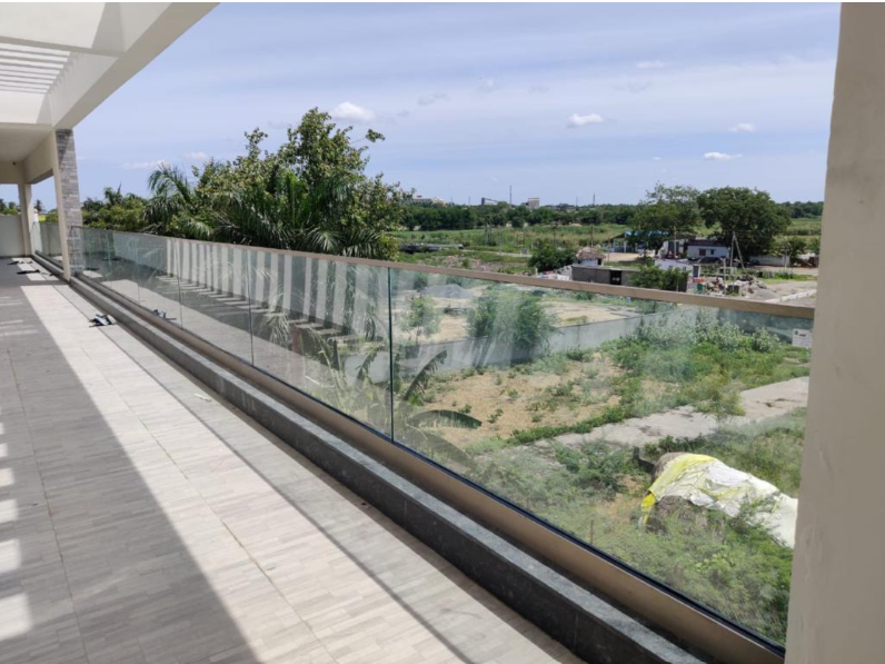 Frameless glass railing solutions with toughened glass panels and stainless steel fittings